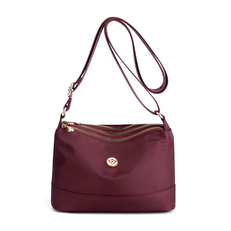 Minimalistische ruime nylon schouder- en crossbodytas