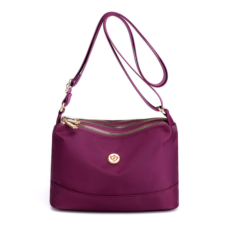 Minimalistische ruime nylon schouder- en crossbodytas