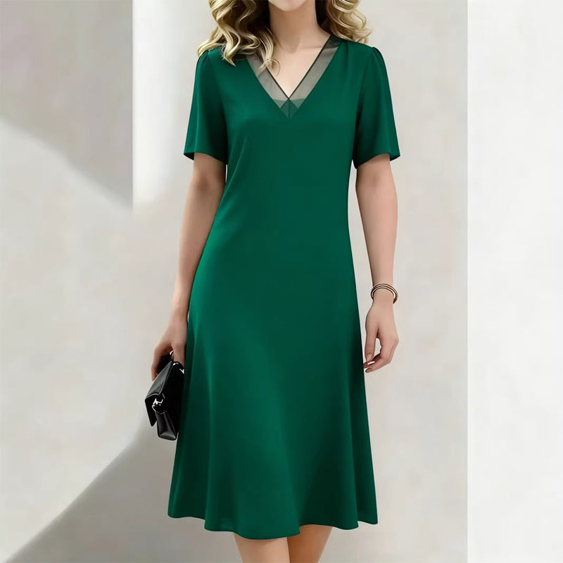 Elegante damesjurk met V-hals en mesh