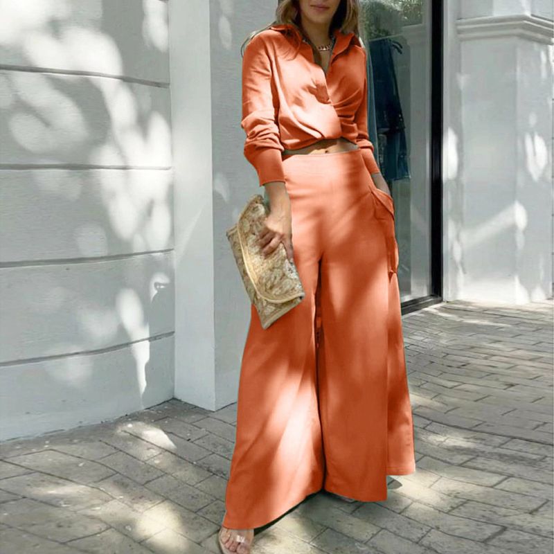 Elegante tweedelige set: top met lange mouwen en boord en broek met hoge taille