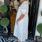 Elegante vrouwenjurk met tierende mouwen en V-hals
