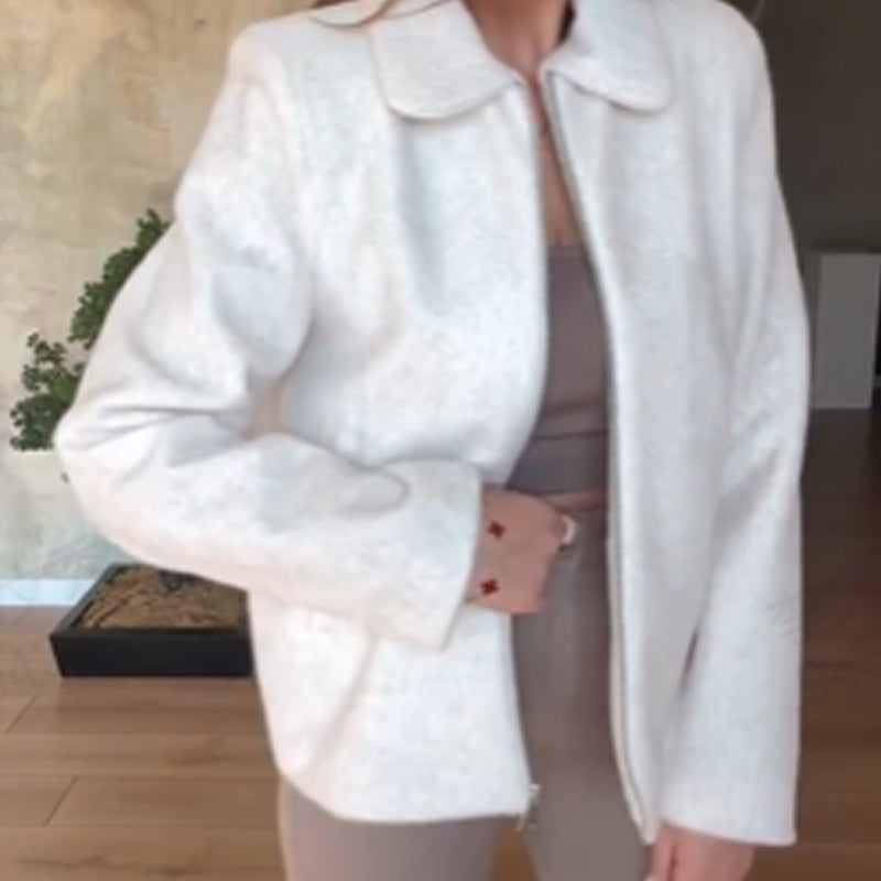 Damesjas met ritssluiting en revers in effen kleur