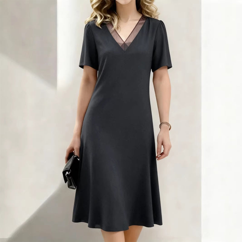 Elegante damesjurk met V-hals en mesh