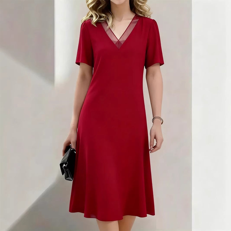 Elegante damesjurk met V-hals en mesh